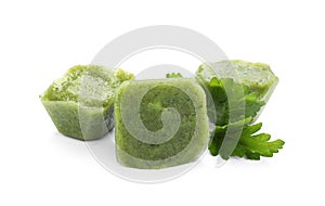 Frozen broccoli puree cubes and ingredient isolated on white