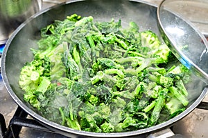 Frozen broccoli turnip green cooking vegetable pan