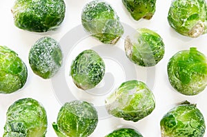 Frozen Brussels sprouts on a white background.