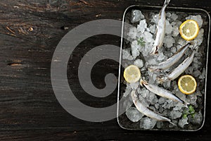 Frozen Capelin Shisamo Fish on Wooden Table, Top View