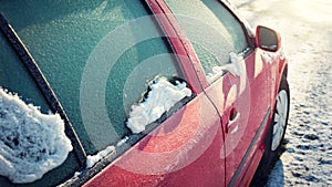 Frozen car window, winter transport issues