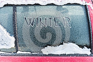 Frozen car window, winter transport issues