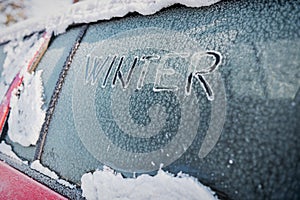 Frozen car window, winter transport issues