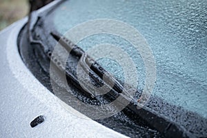 Frozen car windows, auto glass after a freezing rain