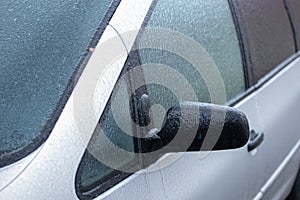 Frozen car windows, auto glass after a freezing rain