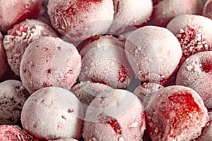 Frozen cherries covered with hoarfrost, texture close up