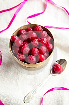 Frozen cherries in a wooden bowl