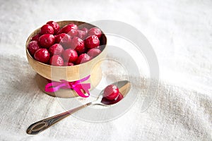 Frozen cherries in a wooden bowl