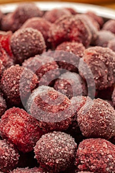 Frozen cherry fruit close up. Cherry in ice crystals