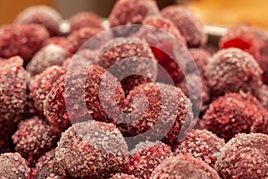 Frozen cherry fruit close up. Cherry in ice crystals