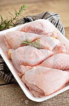 Frozen chicken thighs in a styrofoam