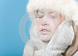 Frozen. Chilled female face covered in snow ice