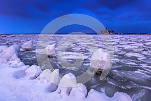 Frozen coastline of Baltic Sea in Gdynia at night