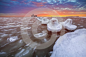 Frozen coastline of Baltic Sea in Gdynia at sunset