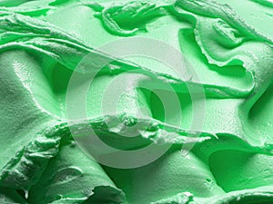 Frozen creamy Mint flavour gelato - full frame detail. Close up of a green surface texture of Ice cream