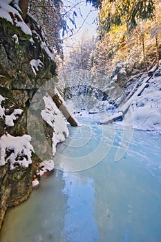 Frozen creek in Sucha Bela gorge in Slovak Paradise during winter