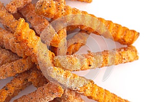 Frozen Crinkled Sweet Potato Fries on a White Background