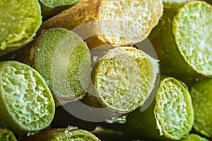 Frozen cut asparagus stalks closeup