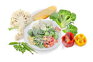 Various frozen and fresh vegetables on a white background