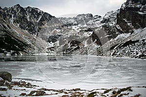 Frozen Czarny Staw Gasienicowy lake in winter in Tatra Mountains close to Zacopane, Poland