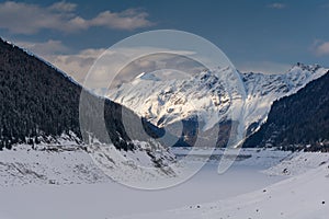 Frozen dam lake in the Alps