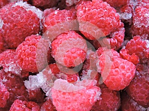 Frozen delicious berries on blue background, closeup.