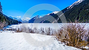 Frozen Duffey Lake and the snow capped peaks of Mount Rohr in BC Canada