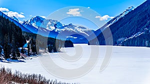 Frozen Duffey Lake and the snow capped peaks of Mount Rohr in BC Canada