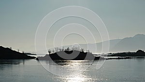 Frozen Fjord view with small island in front of Ringstad resort in Vesteralen, Norway in winter