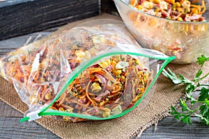 Frozen food, frozen salad. Storing food in a bag in the freezer