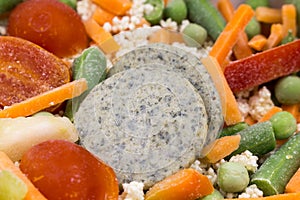 Frozen food: mix of couscous, vegetables and sauce closeup