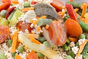 Frozen food: mix of couscous, vegetables and sauce closeup