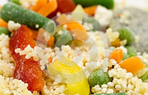 Frozen food: mix of couscous, vegetables and sauce closeup