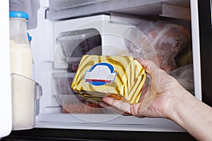 Frozen food in the refrigerator. Margarine, butter, vegetables on the freezer shelves