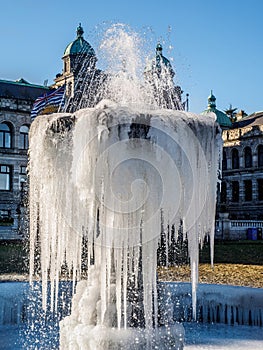 Frozen fountain on the lawn