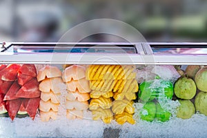 Frozen fruit trimmed ice in a glass cabinet for sale