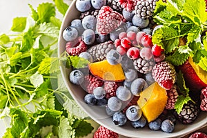 Frozen fruits blueberries blackberry raspberry red currant peach and herbs melissa