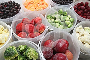 Frozen fruits and vegetables in plastic containers