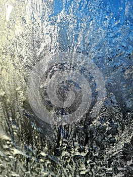 Frozen glass. Frost pattern on the window