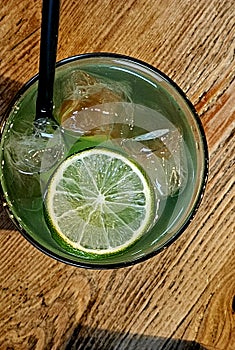 frozen glass of mojito, an alcoholic drink based on rum and lime and typically summer soda
