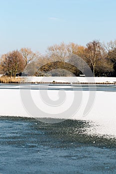 Frozen Goldsworth Park Lake in Woking, Surrey, UK