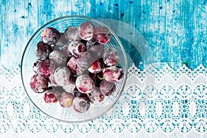 Frozen grapes cluster in the bowl