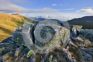 Frozen grass and rocks on Skalka mountain during autumn in Low Tatras mountains