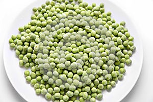 Frozen green peas on a plate