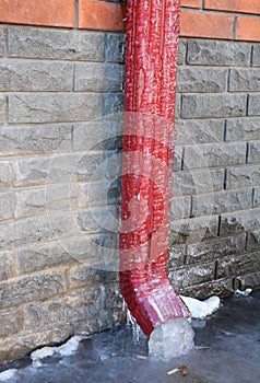 Frozen Gutter or Downspout. Gutters and Downspouts Sometimes Freeze into Solid Blocks of Ice.