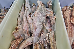 Frozen hake in the supermarket fridge.