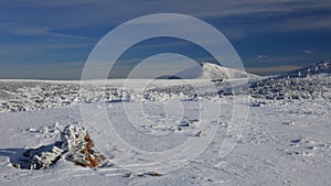 Frozen high plateau with mountain in the background