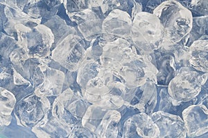 Frozen ice cubes for cocktails. Background with ice cubes. Top view.