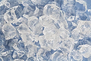 Frozen ice cubes for cocktails. Background with ice cubes. Top view.