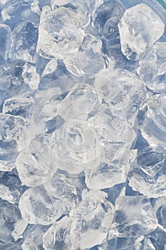 Frozen ice cubes for cocktails. Background with ice cubes. Top view.